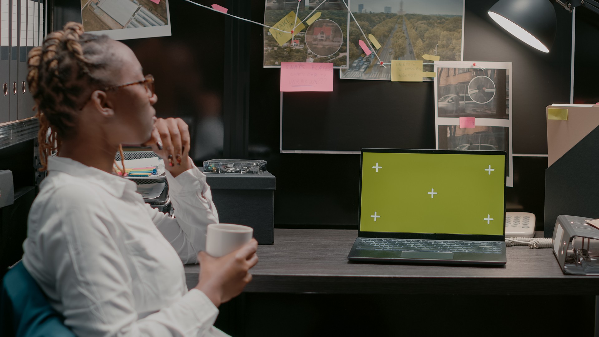 African american agent using greenscreen on laptop