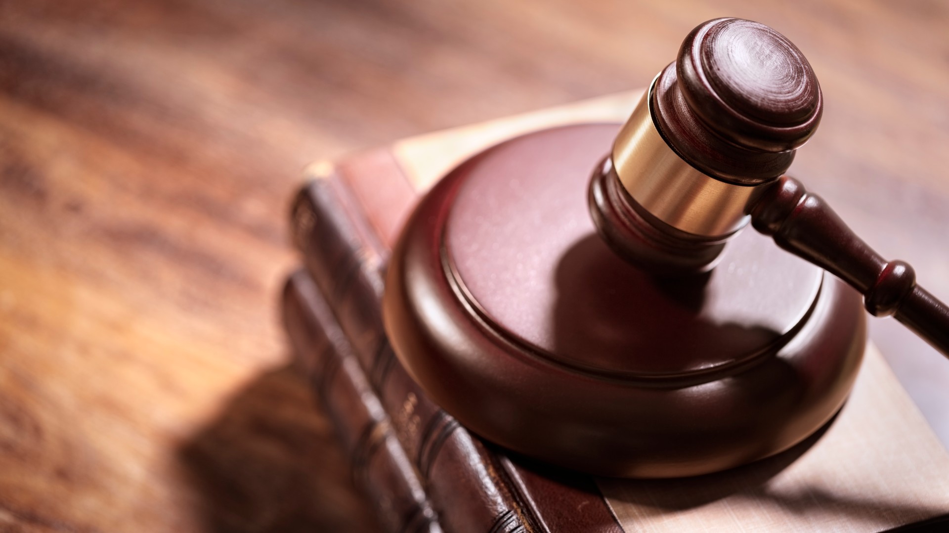 Judge gavel and law books in court background with copy space